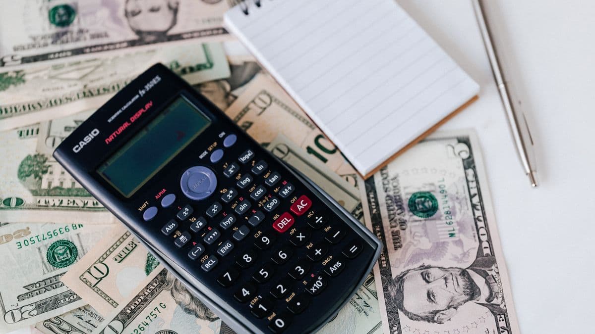 A calculator and cash for zero-based budgeting
